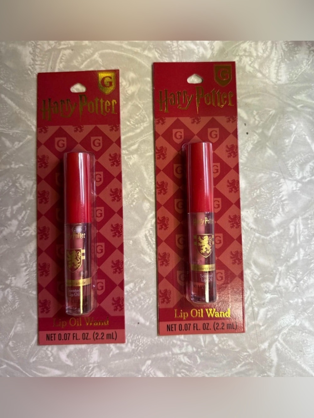 2 Warner Bros. Harry Potter Gryffindor pomegranate Lip Oil Wands